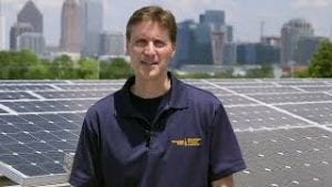 Thumbnail of Video 1 - Rich Simmons standing in front of solar array.
