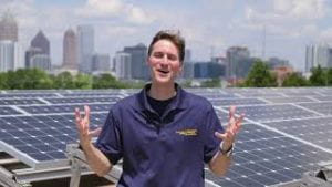 Thumbnail for Video 2 - Rich Simmons standing in front of a solar array.